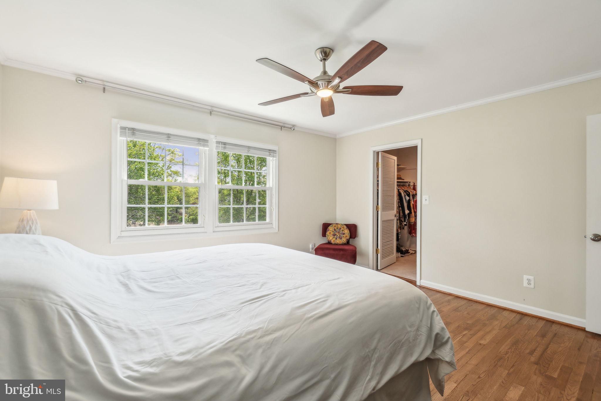 8248 Carrleigh Parkway Springfield, VA 22152 - Photo 14 of 45 a bedroom with a large bed and a window