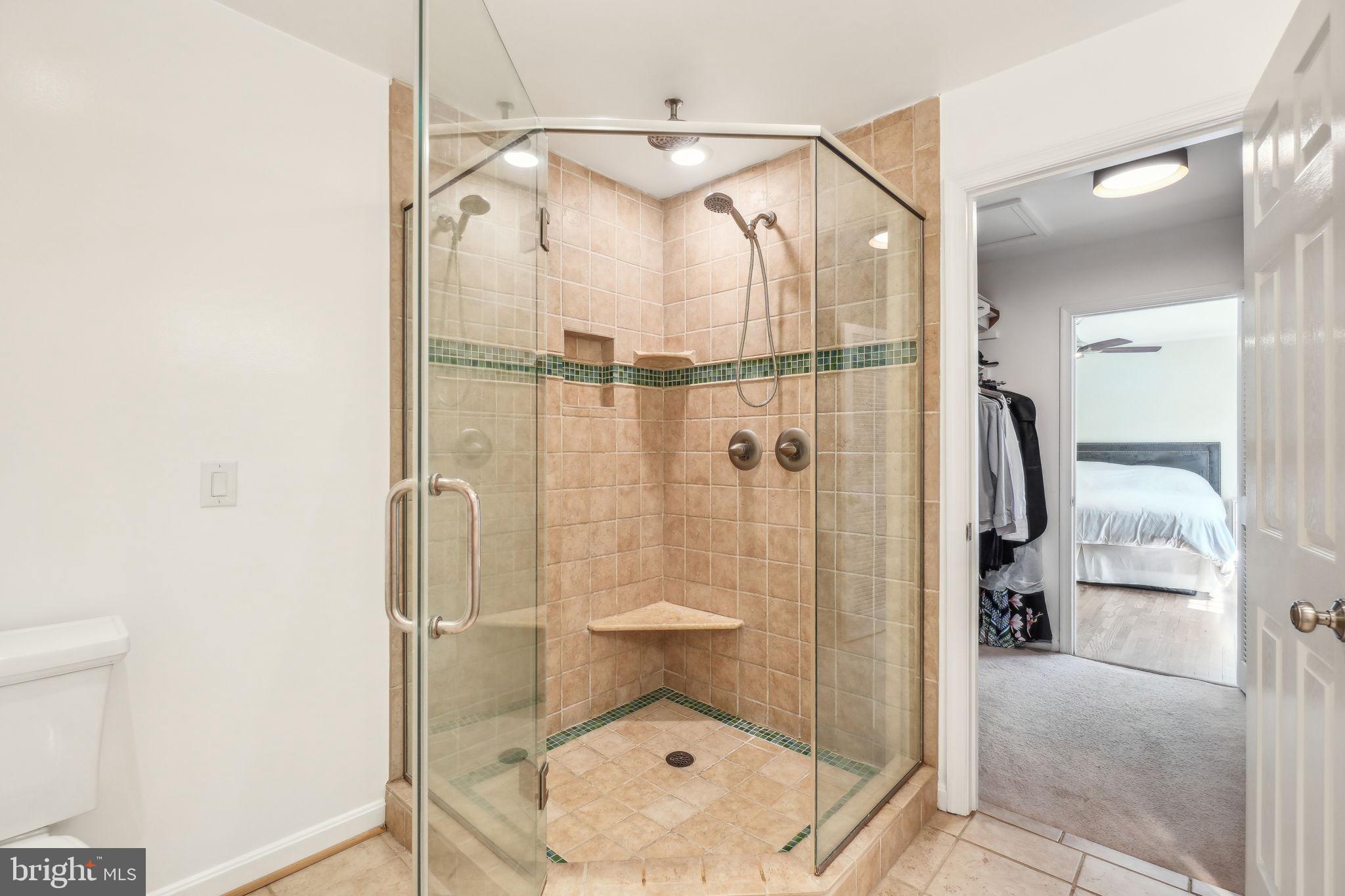 8248 Carrleigh Parkway Springfield, VA 22152 - Photo 17 of 45 a bathroom with a shower and toilet