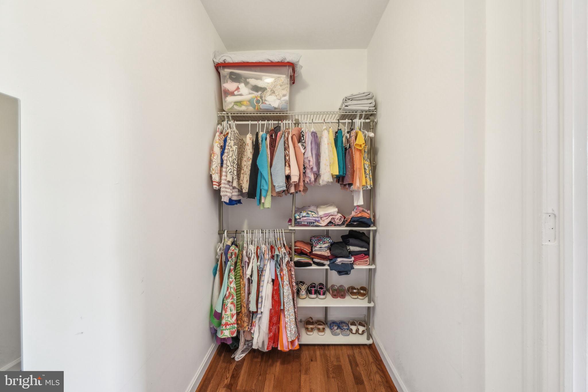 8248 Carrleigh Parkway Springfield, VA 22152 - Photo 20 of 45 a view of walk in closet with clothes and shoes