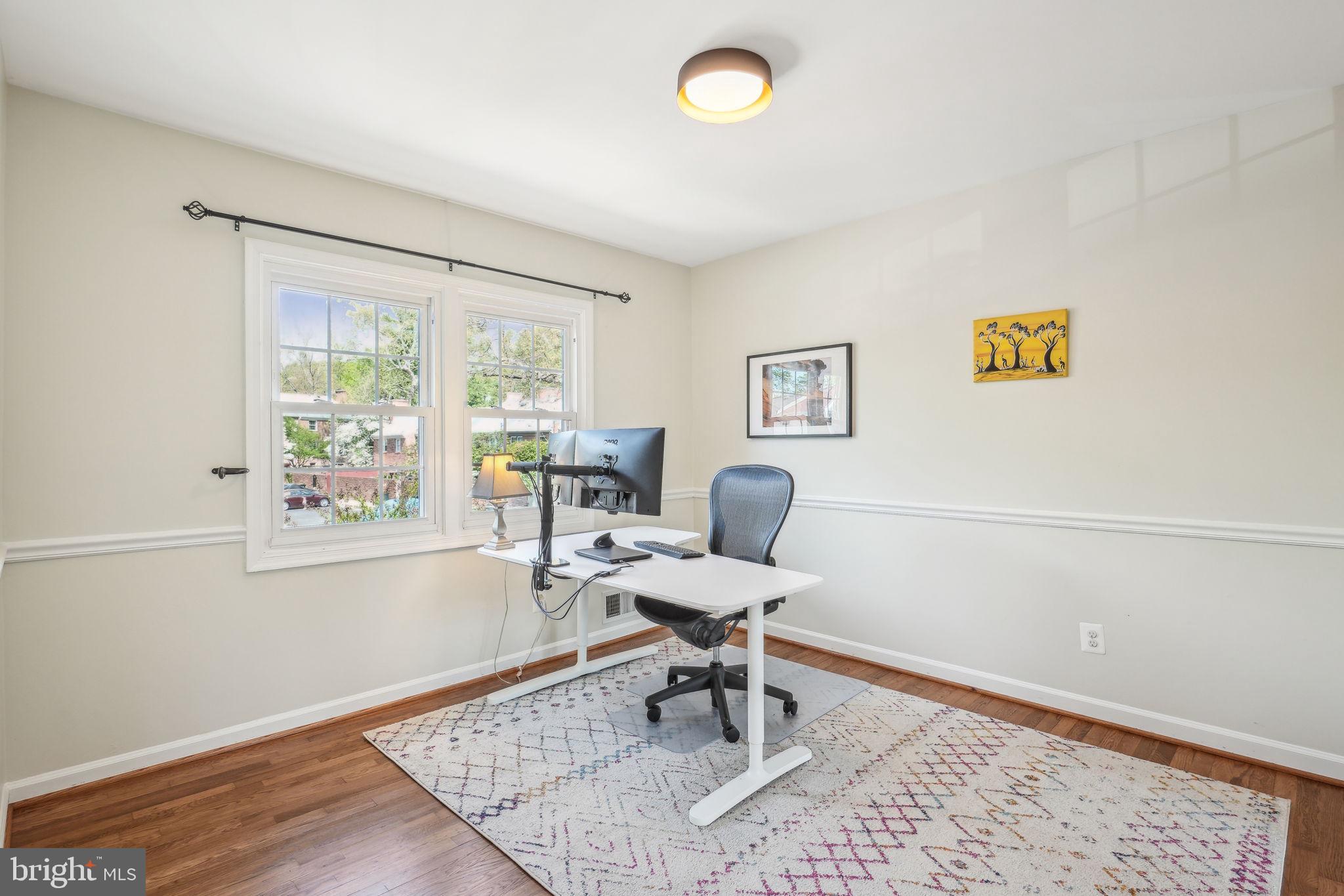 8248 Carrleigh Parkway Springfield, VA 22152 - Photo 22 of 45 a work room with wooden floor and a window