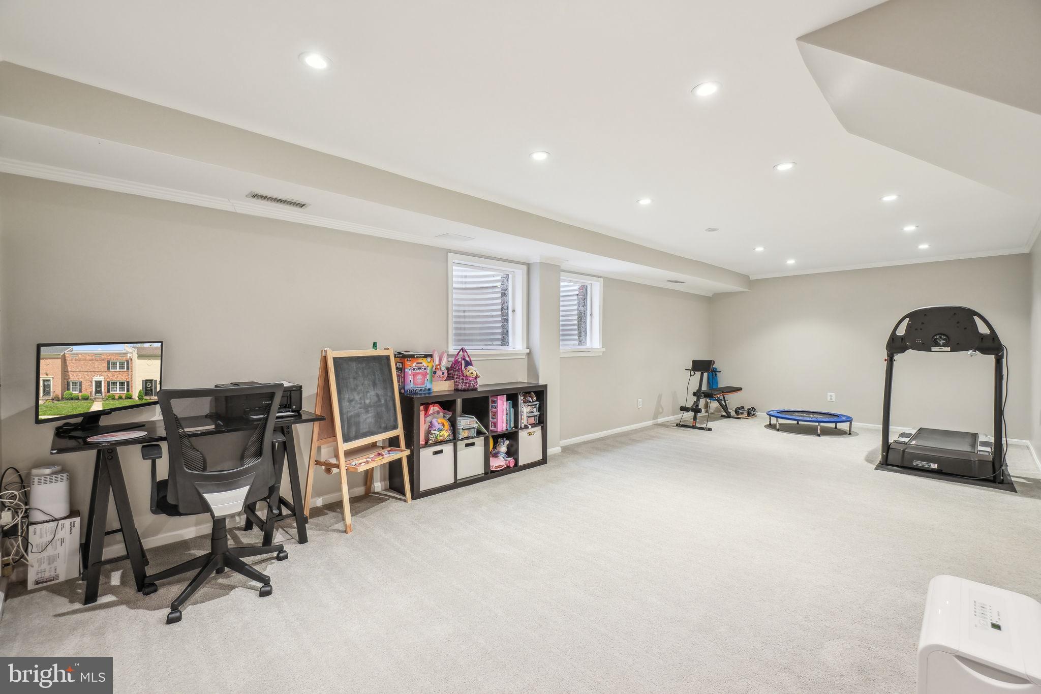 8248 Carrleigh Parkway Springfield, VA 22152 - Photo 27 of 45 a view of a room with gym equipment