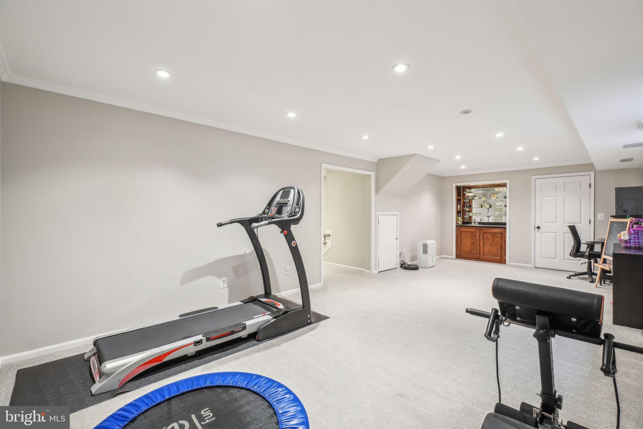 8248 Carrleigh Parkway Springfield, VA 22152 - Photo 28 of 45 a view of a room with gym equipment