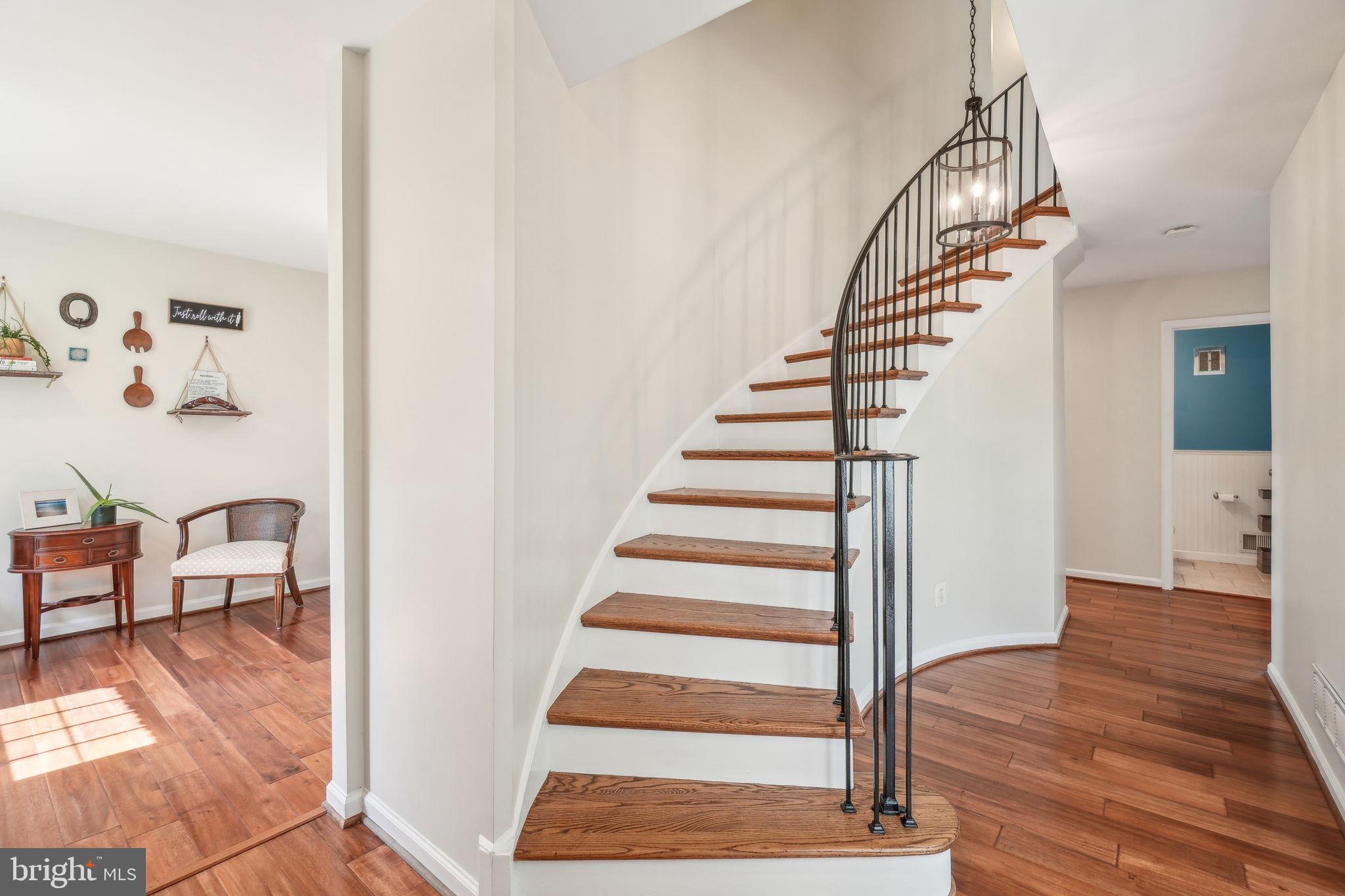 8248 Carrleigh Parkway Springfield, VA 22152 - Photo 3 of 45 a view of entryway and hall with wooden floor