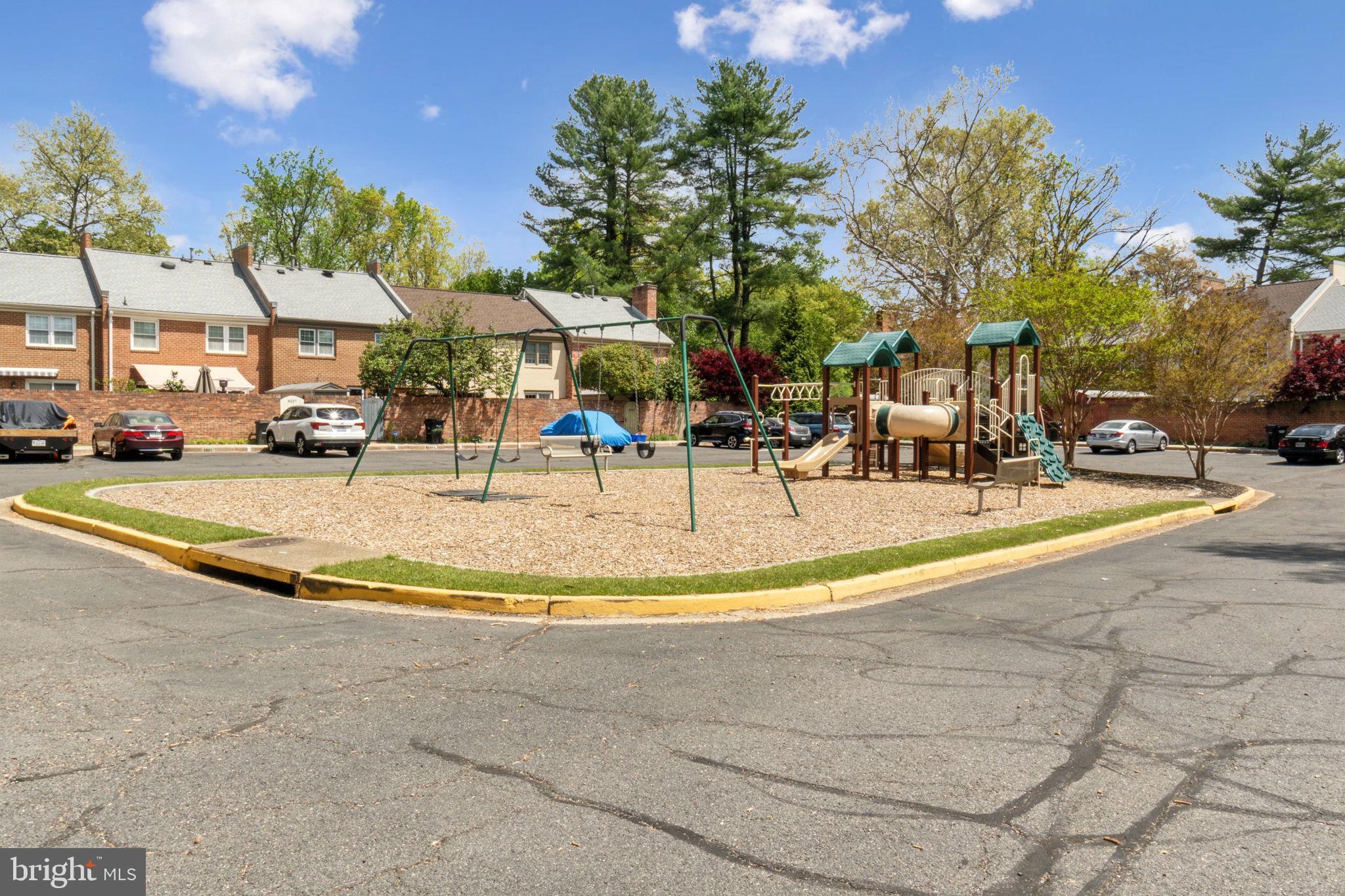 8248 Carrleigh Parkway Springfield, VA 22152 - Photo 34 of 45 a view of a swimming pool with a patio