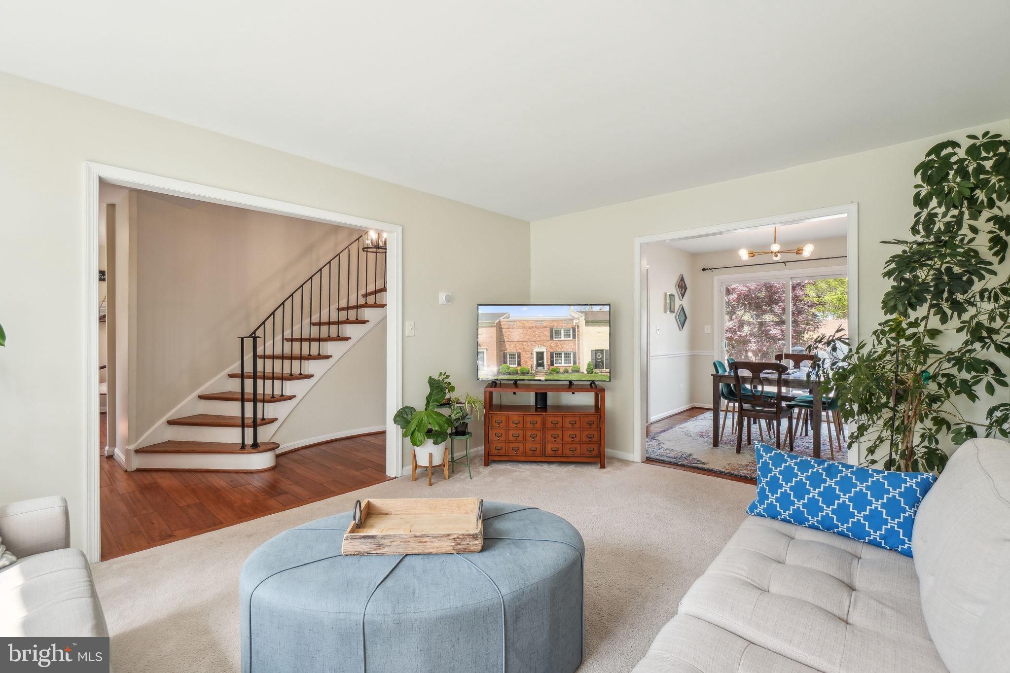 8248 Carrleigh Parkway Springfield, VA 22152 - Photo 5 of 45 a living room with furniture and a potted plant