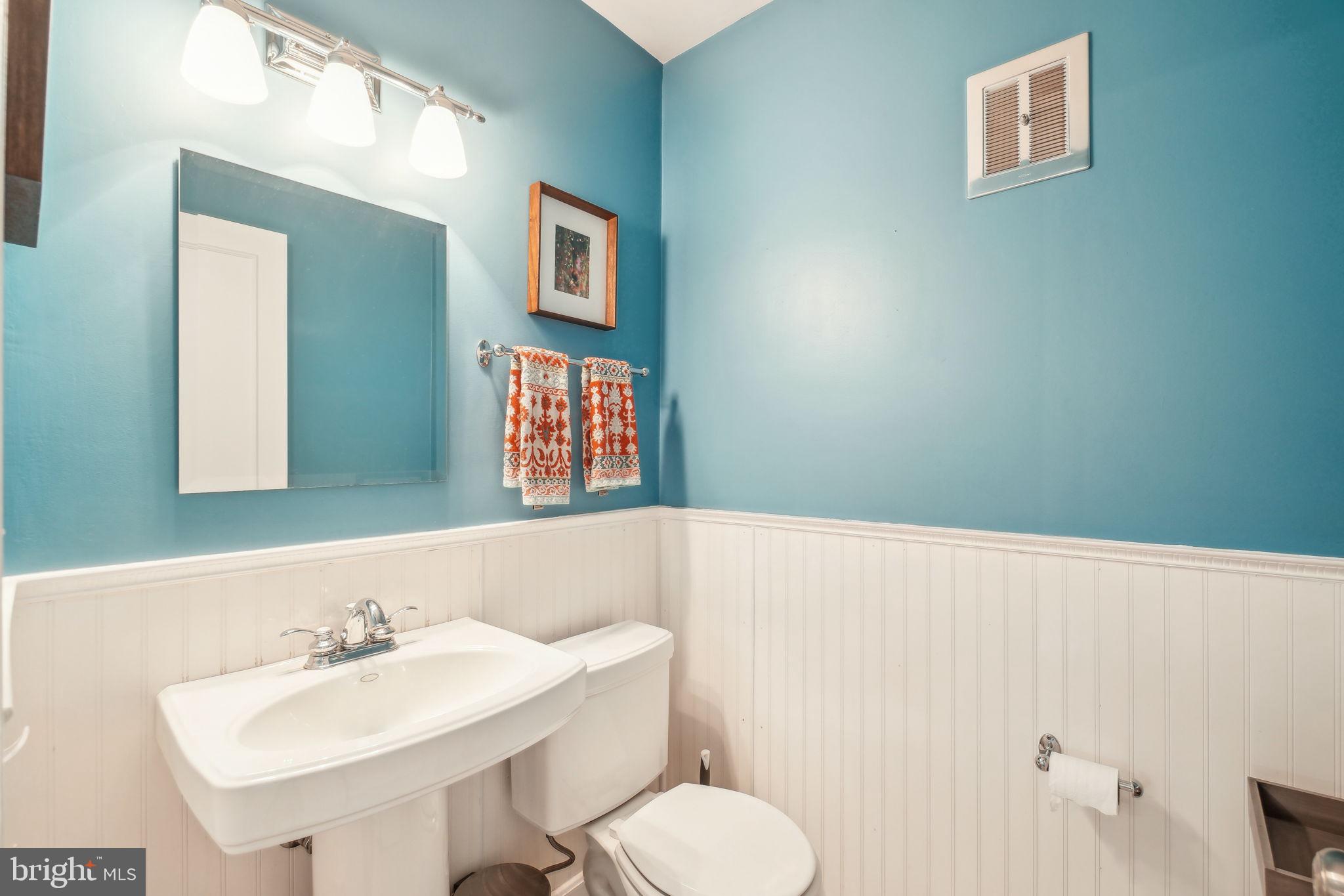 8248 Carrleigh Parkway Springfield, VA 22152 - Photo 8 of 45 a bathroom with a sink and a mirror