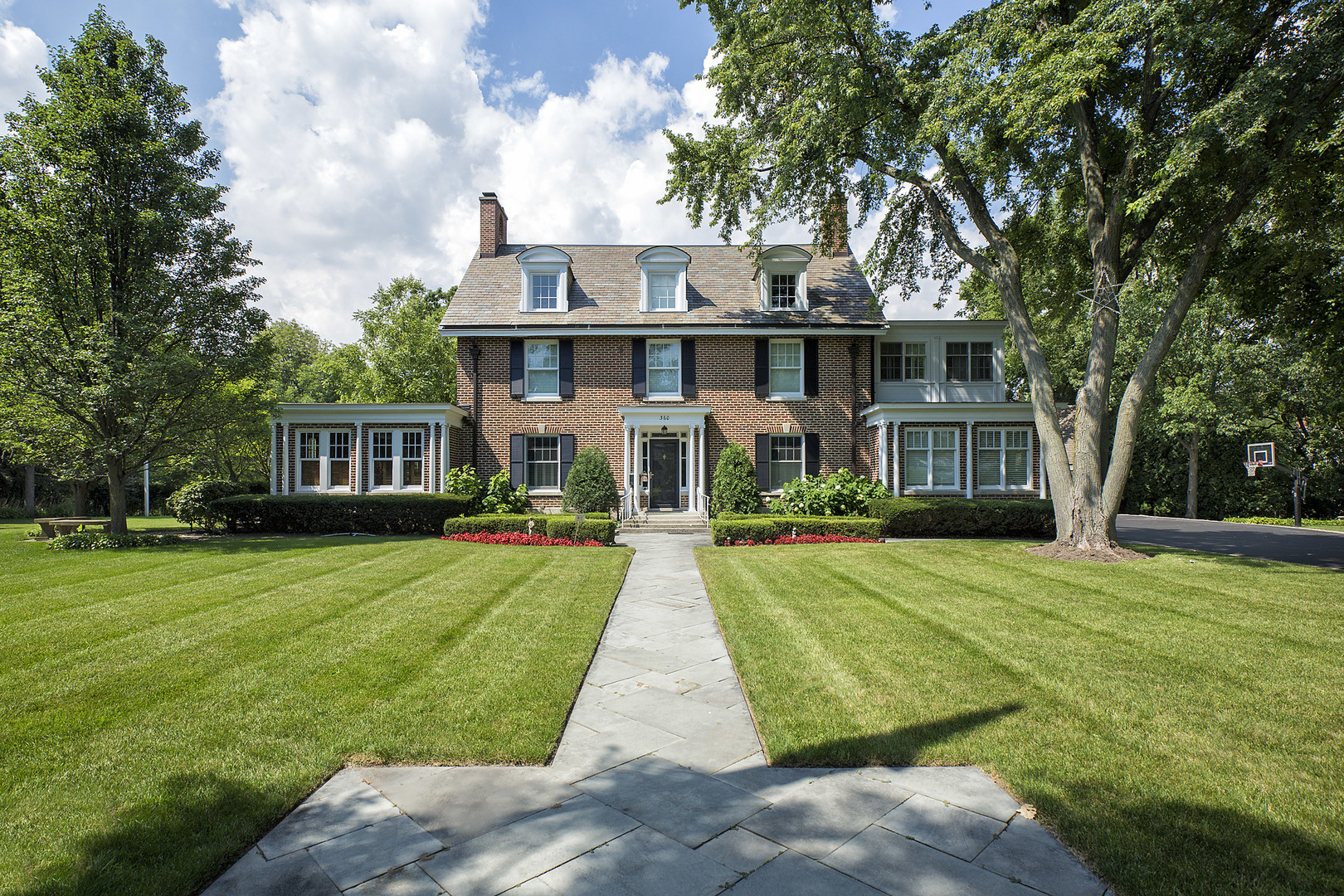 360 Palos Road Glencoe, IL 60022 - Photo 2 of 25 a front view of a house with yard and green space
