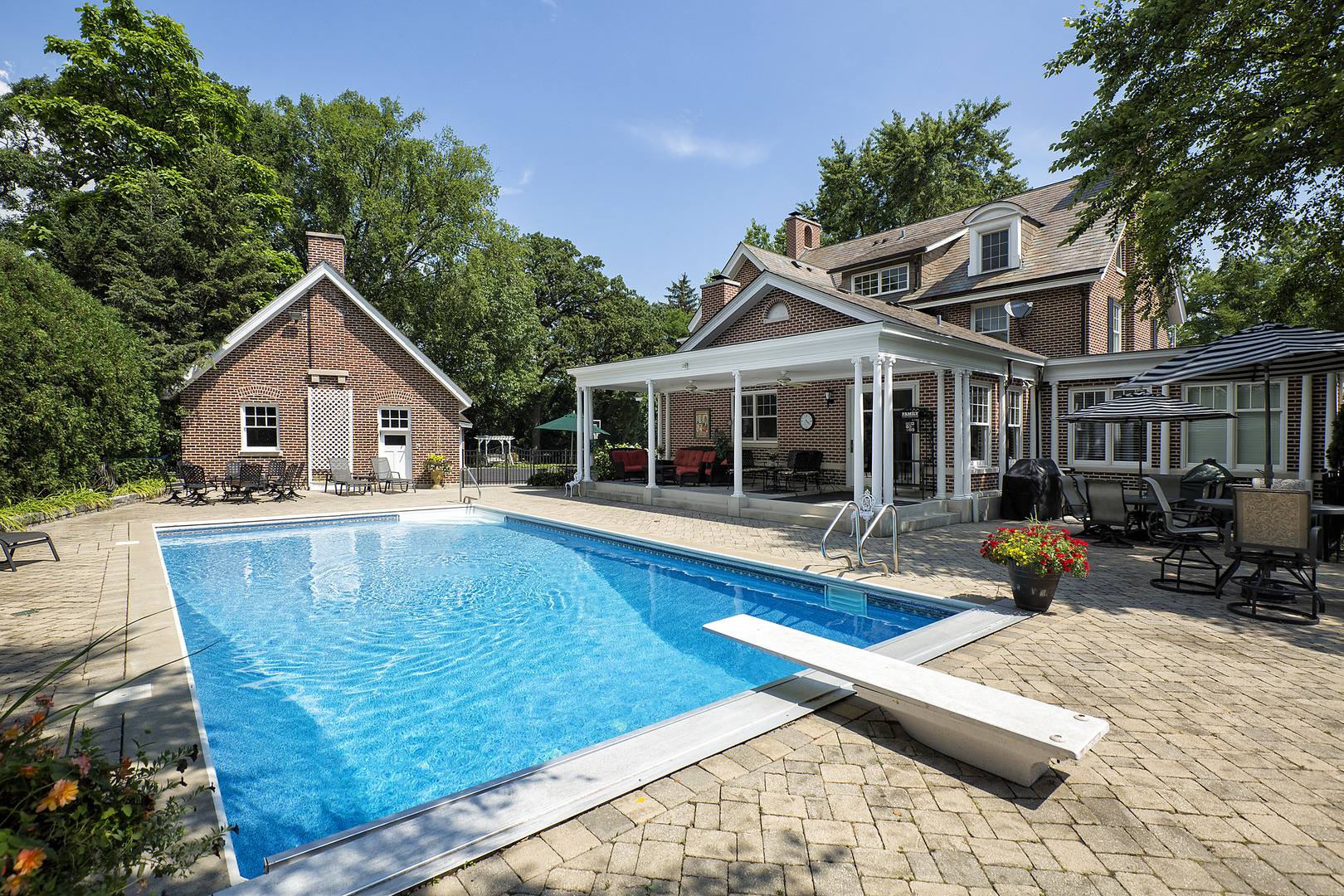360 Palos Road Glencoe, IL 60022 - Photo 21 of 25 a view of a house with swimming pool and sitting area