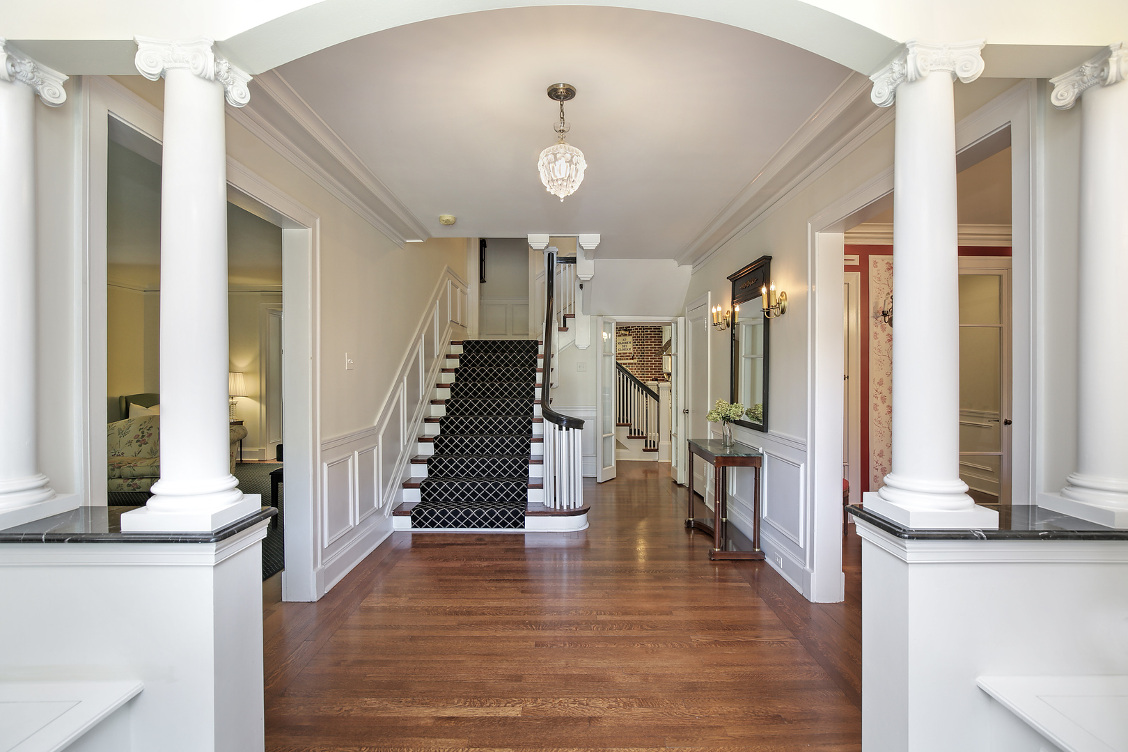 360 Palos Road Glencoe, IL 60022 - Photo 4 of 25 a view of a hallway with wooden floor and staircase