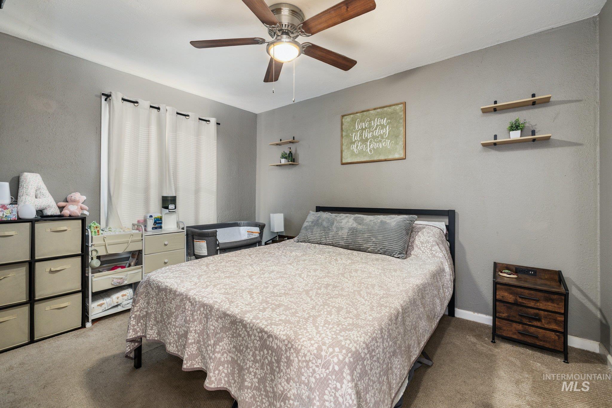 1504 2nd Street North Nampa, ID 83687 - Photo 16 of 29 Carpeted bedroom featuring a ceiling fan and baseboards