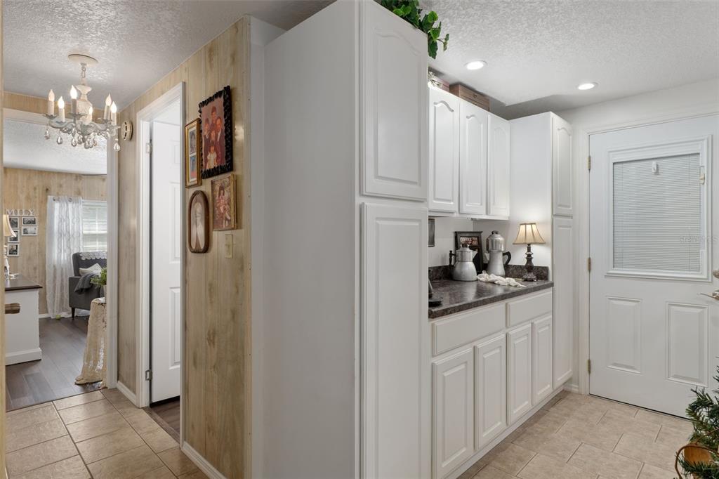8197 Fiesta Street Brooksville, FL 34613 - Photo 19 of 49 a kitchen with stainless steel appliances granite countertop a refrigerator and a stove top oven