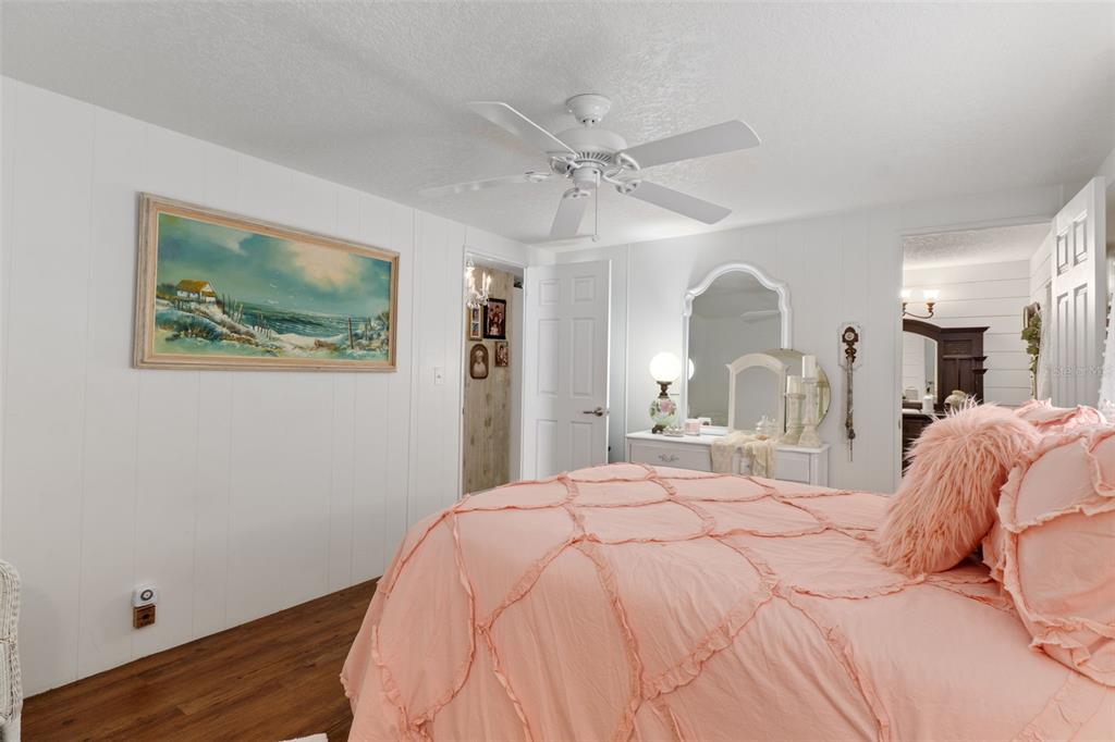 8197 Fiesta Street Brooksville, FL 34613 - Photo 24 of 49 a bedroom with a bed and a painting on the wall