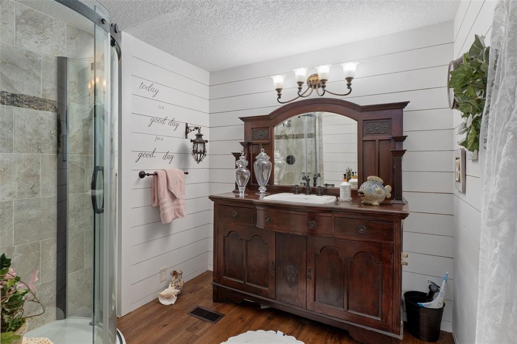 8197 Fiesta Street Brooksville, FL 34613 - Photo 25 of 49 a bathroom with a sink and a mirror