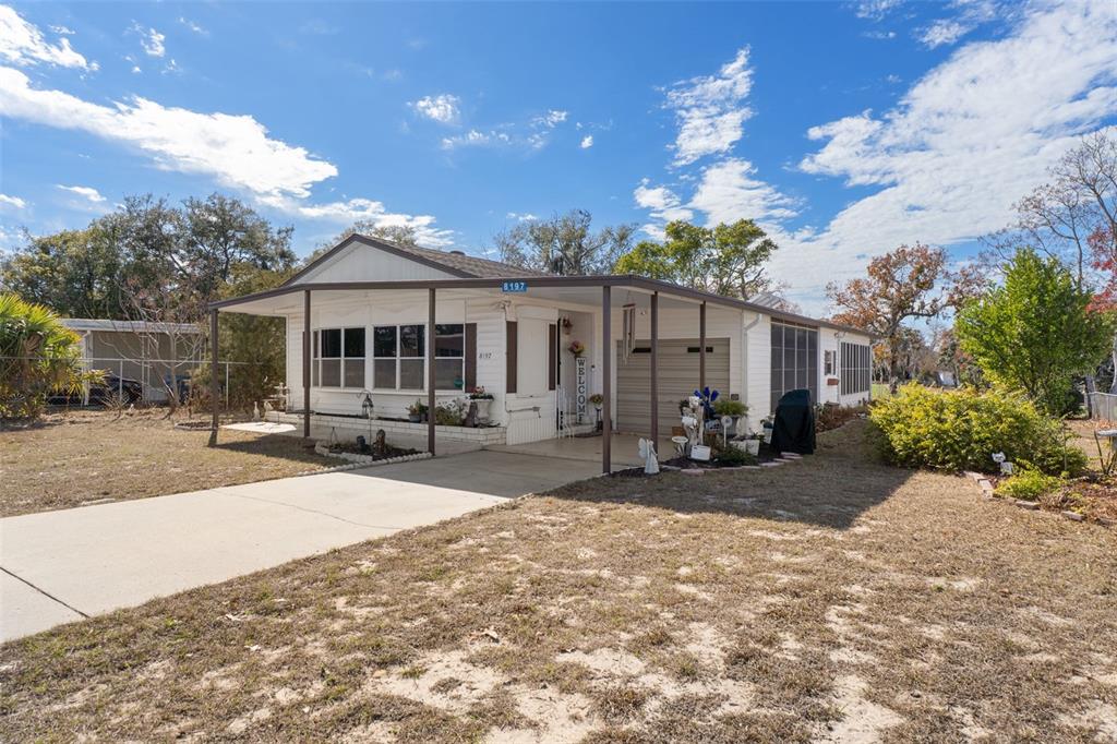 8197 Fiesta Street Brooksville, FL 34613 - Photo 3 of 49 a view of a house with patio
