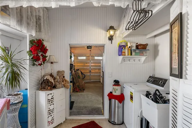 a bedroom with furniture and a chandelier