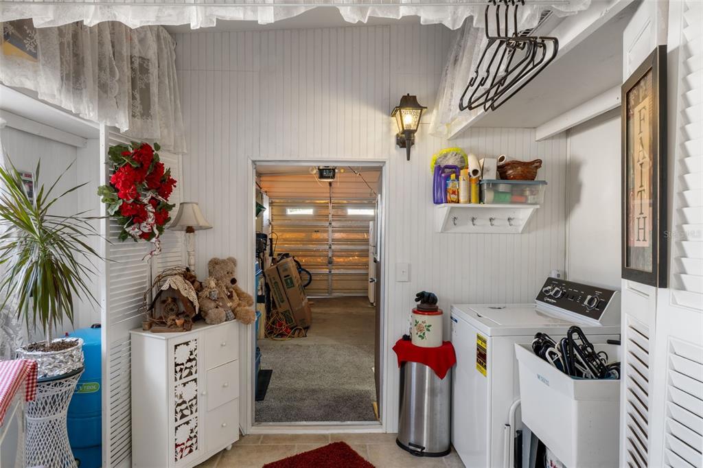 8197 Fiesta Street Brooksville, FL 34613 - Photo 36 of 49 a bedroom with furniture and a chandelier