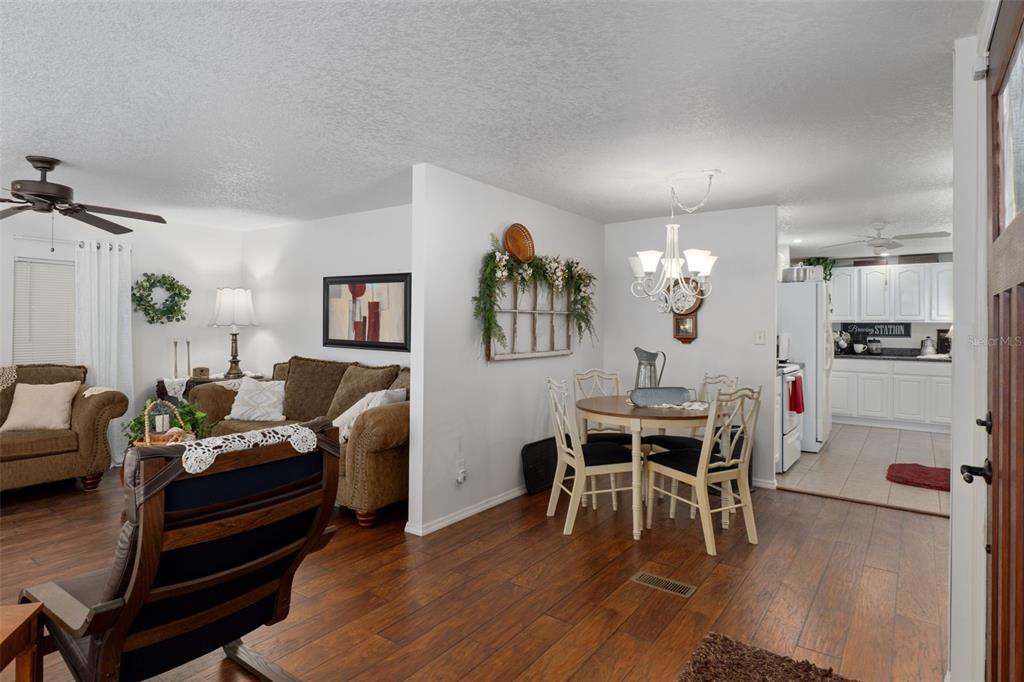 8197 Fiesta Street Brooksville, FL 34613 - Photo 7 of 49 a dining room with furniture and wooden floor