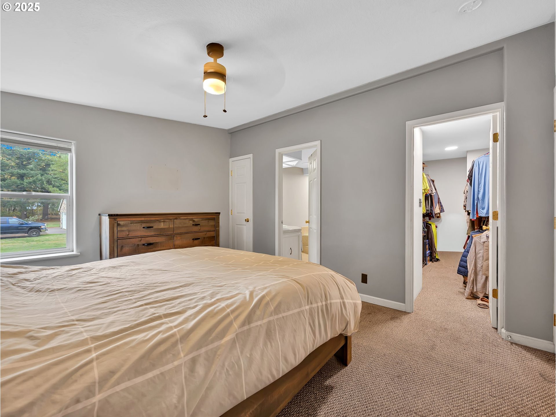23754 South Bard Road Estacada, OR 97023 - Photo 13 of 39 a bedroom with a bed and a chandelier