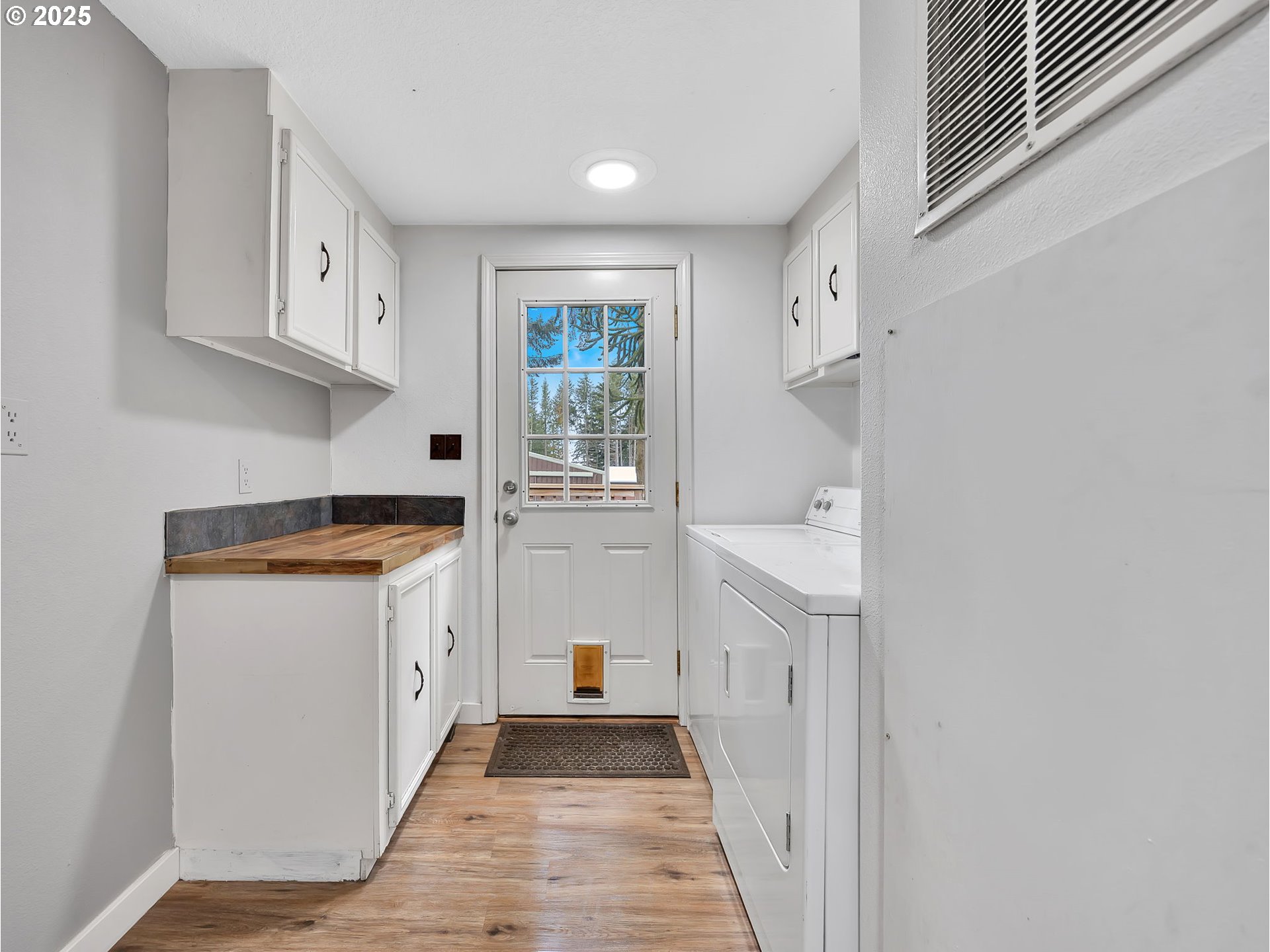 23754 South Bard Road Estacada, OR 97023 - Photo 19 of 39 a kitchen with granite countertop white cabinets and white appliances