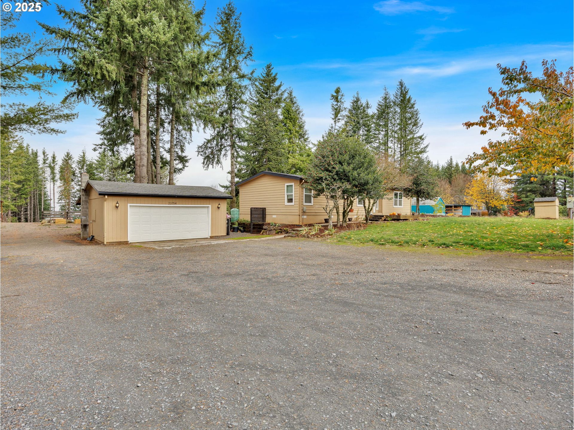 23754 South Bard Road Estacada, OR 97023 - Photo 35 of 39 a view of white house with a big yard and large trees
