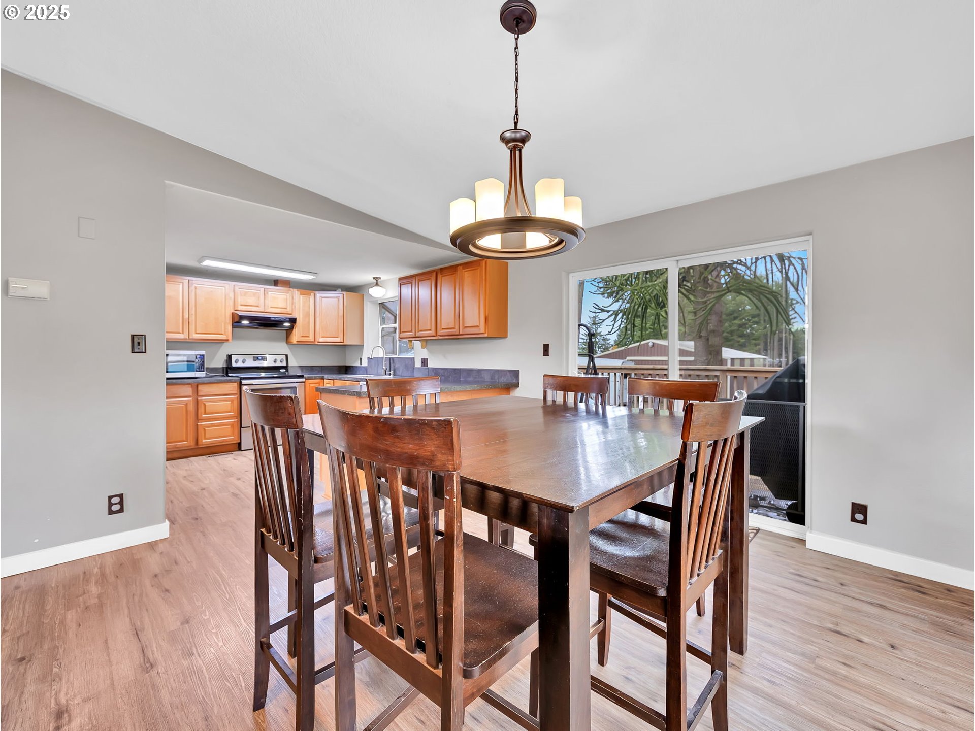 23754 South Bard Road Estacada, OR 97023 - Photo 9 of 39 a dining room with furniture a window and wooden floor