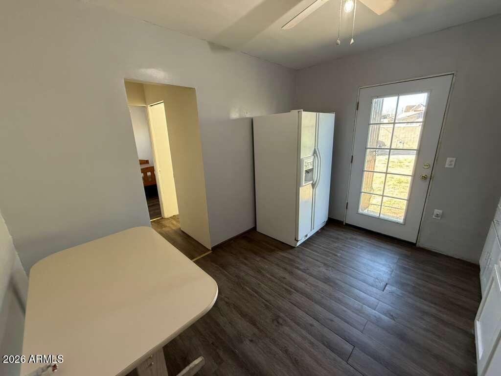 936 East 8th Street, Unit REAR Douglas, AZ 85607 - Photo 3 of 7 a view of kitchen with furniture and wooden floor