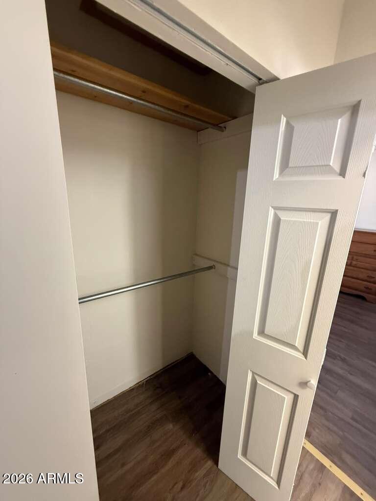936 East 8th Street, Unit REAR Douglas, AZ 85607 - Photo 6 of 7 a view of walk in closet with wooden floor