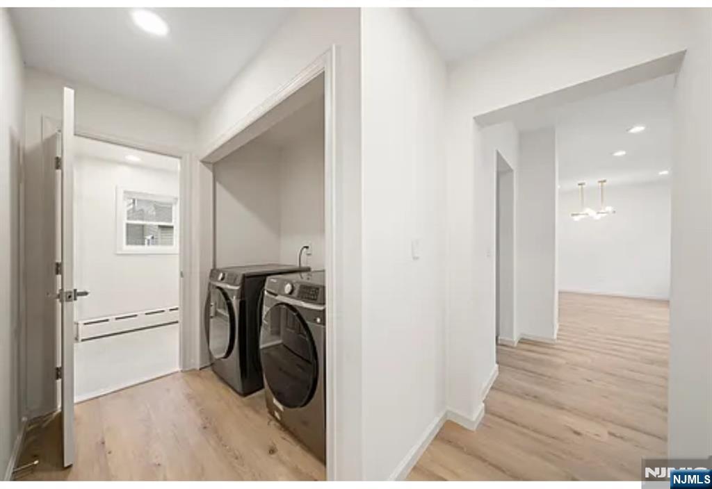 57 Byrne Street, Unit 1 Hackensack, NJ 07601 - Photo 11 of 16 a view of a hallway with a washer and dryer
