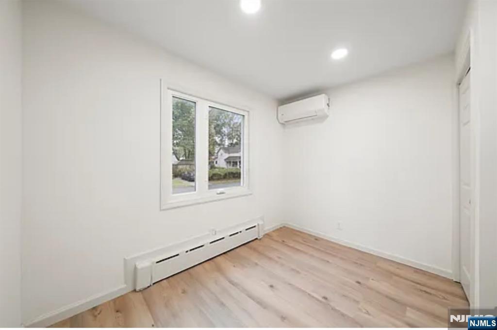 57 Byrne Street, Unit 1 Hackensack, NJ 07601 - Photo 13 of 16 an empty room with a window