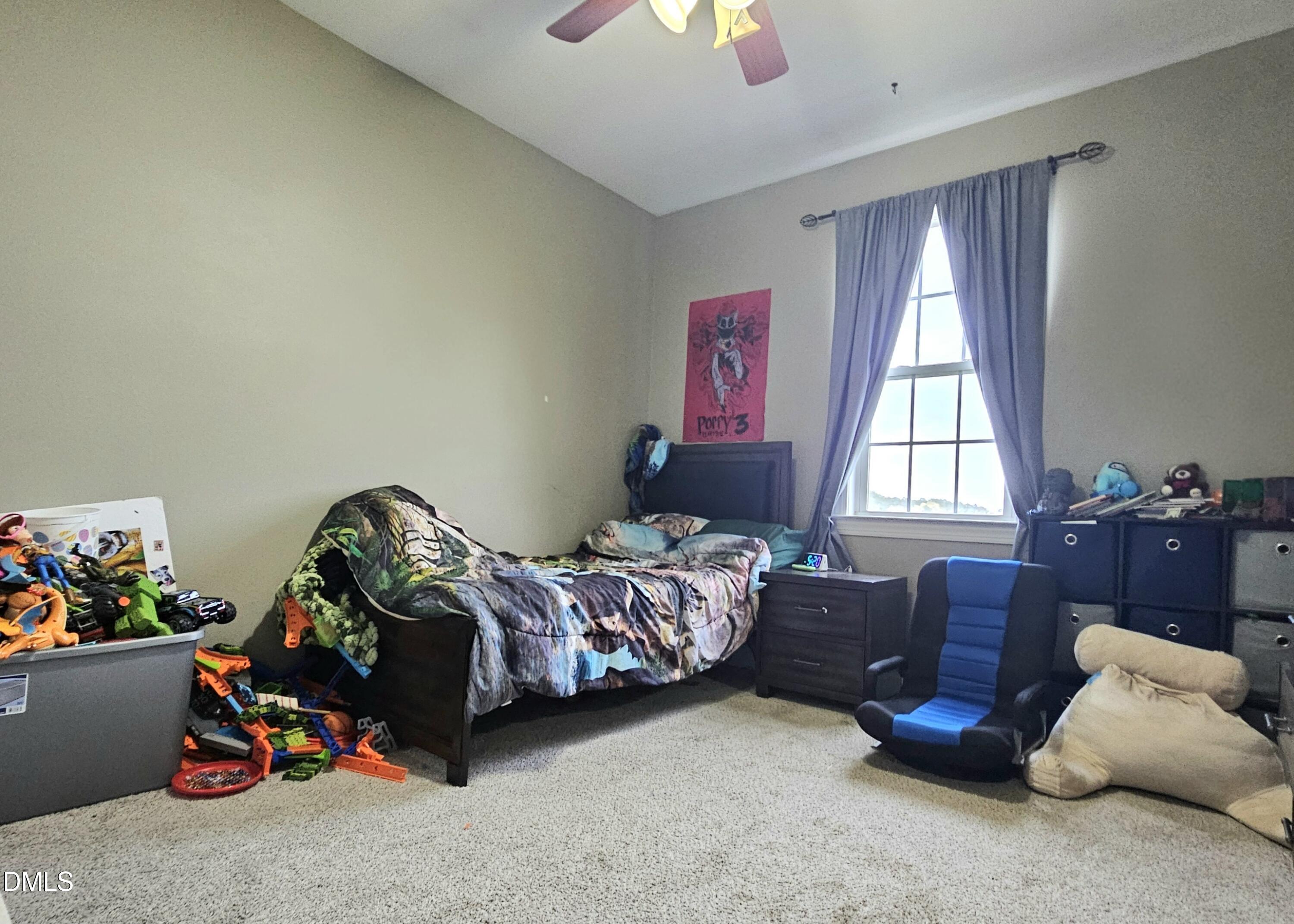 40 Wild Winds Drive Coats, NC 27521 - Photo 15 of 26 a bedroom with bed and a window