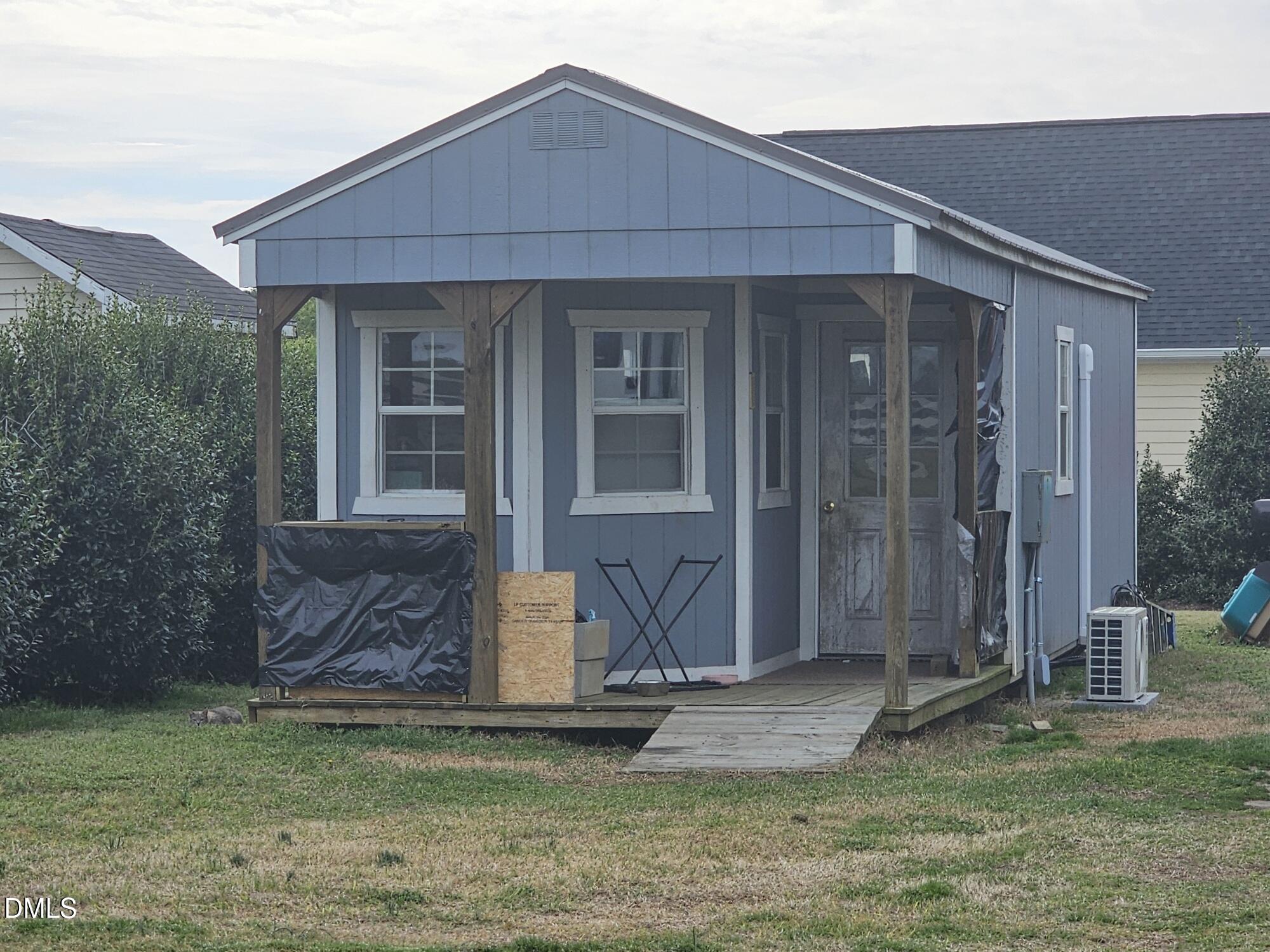 40 Wild Winds Drive Coats, NC 27521 - Photo 25 of 26 a front view of a house with garden
