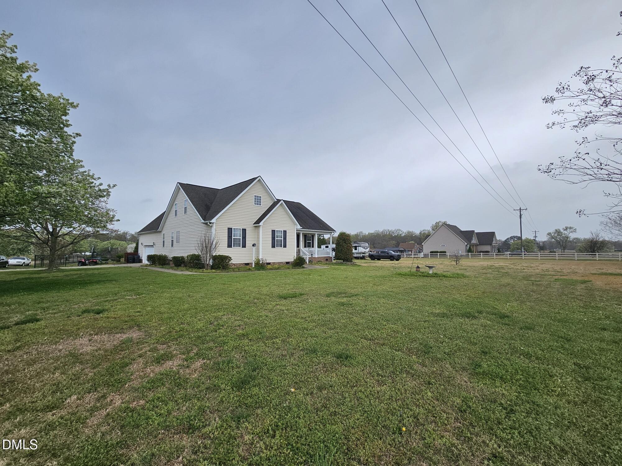 40 Wild Winds Drive Coats, NC 27521 - Photo 3 of 26 a front view of a house with garden