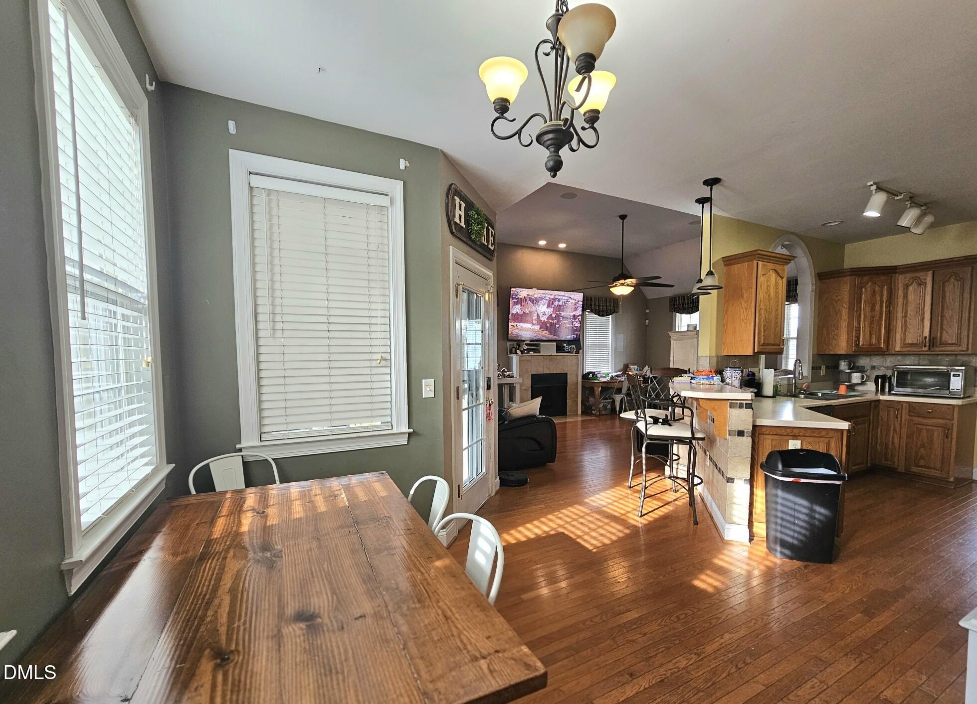 40 Wild Winds Drive Coats, NC 27521 - Photo 9 of 26 a view of a dining room with furniture window and wooden floor