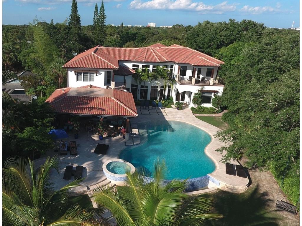 228 West Riverside Drive Jupiter, FL 33469 - Photo 1 of 6 an aerial view of a house with yard swimming pool and outdoor seating