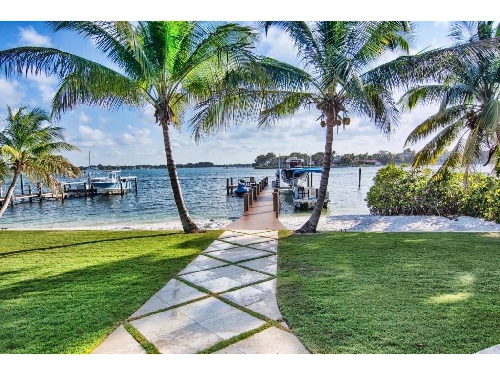 228 West Riverside Drive Jupiter, FL 33469 - Photo 3 of 6 a view of swimming pool with a table and chairs