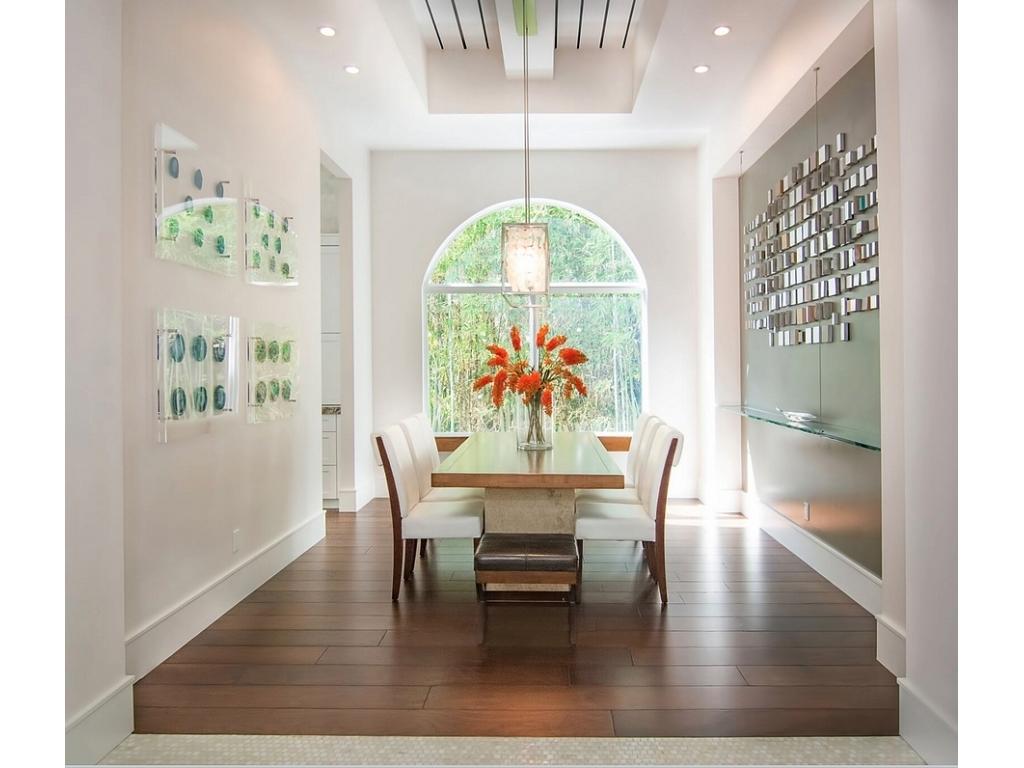 228 West Riverside Drive Jupiter, FL 33469 - Photo 5 of 6 a dining room with furniture a rug and a painting