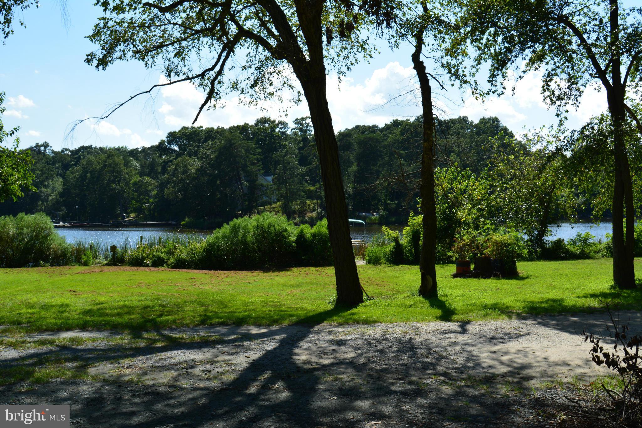 348 Ridge Road Pasadena, MD 21122 - Photo 1 of 27 a view of a park with large trees