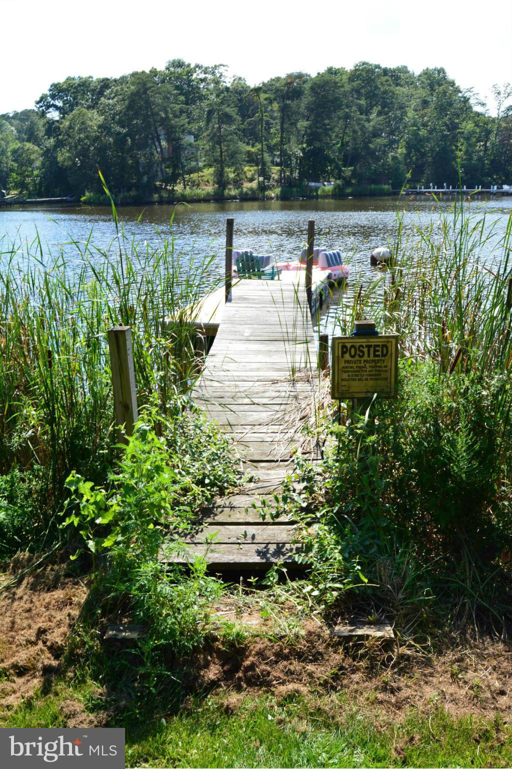 348 Ridge Road Pasadena, MD 21122 - Photo 2 of 27 a view of a lake with a mountain in the background