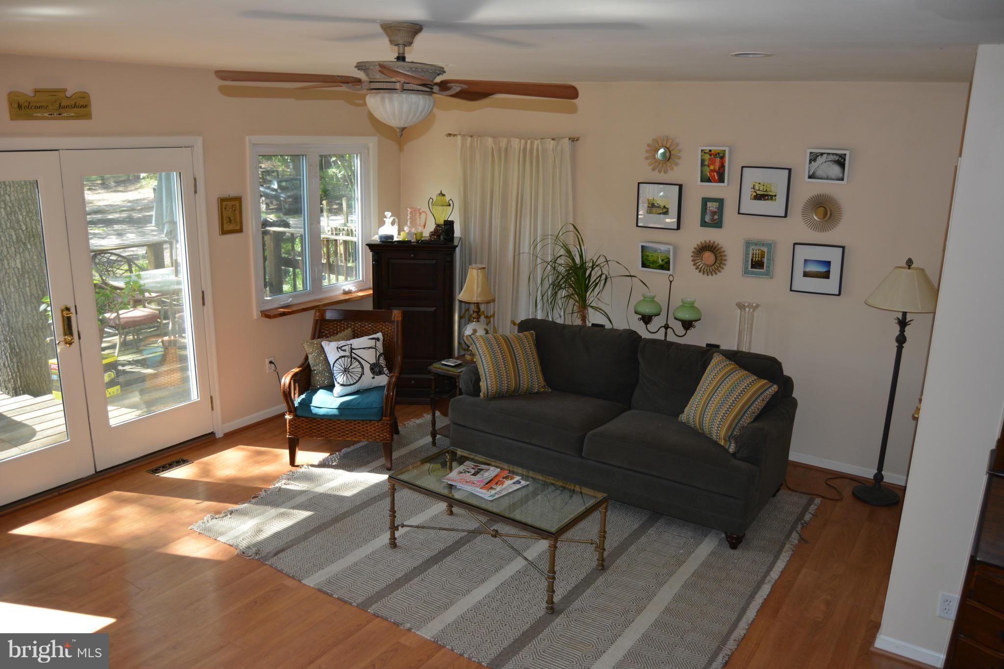 348 Ridge Road Pasadena, MD 21122 - Photo 11 of 27 a living room with furniture and a window