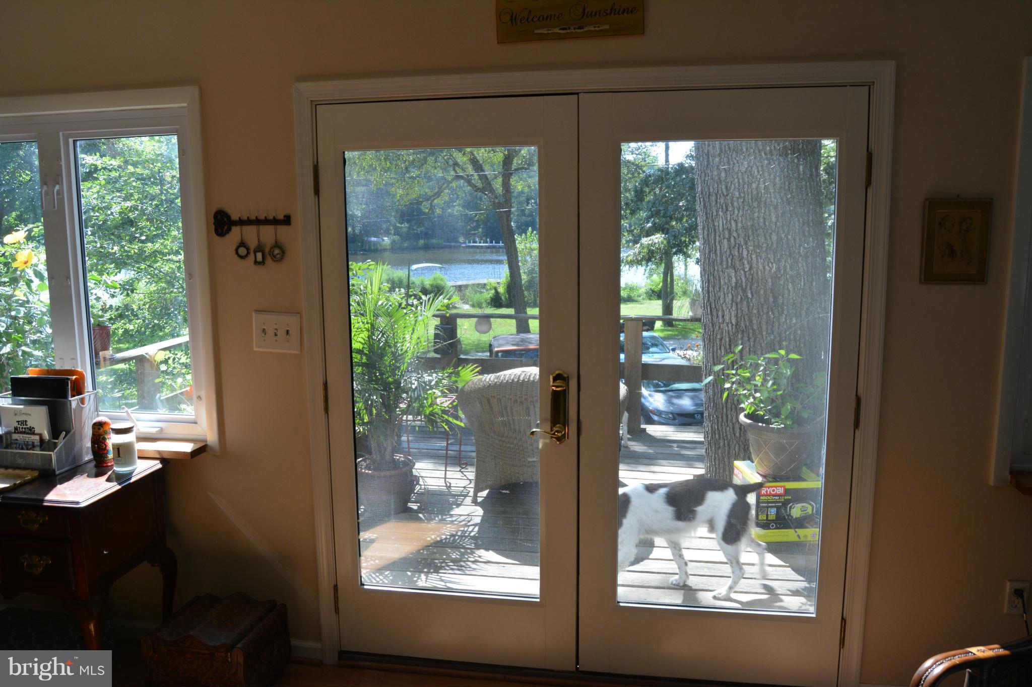 348 Ridge Road Pasadena, MD 21122 - Photo 13 of 27 a view of a porch with furniture and front door