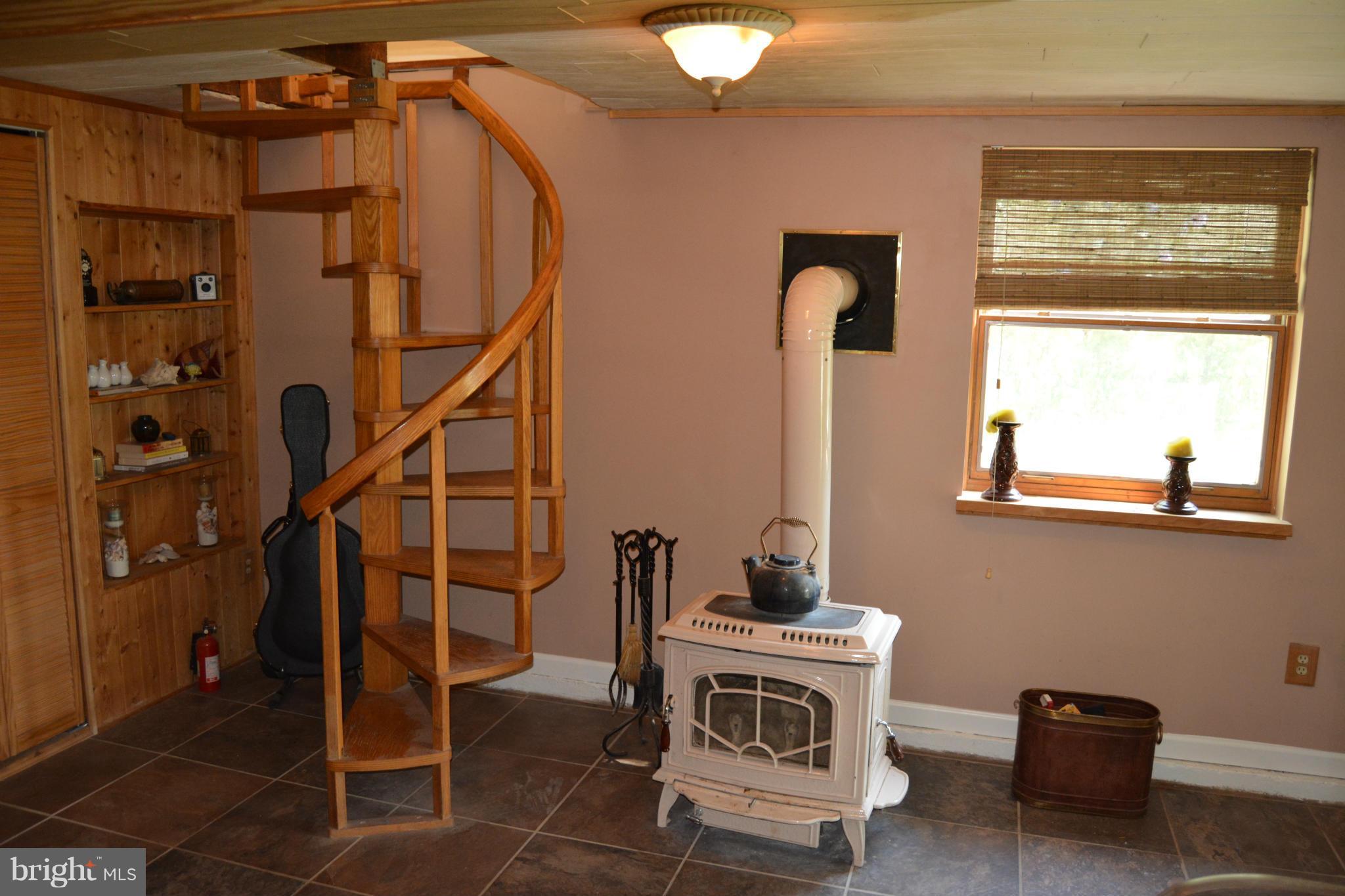 348 Ridge Road Pasadena, MD 21122 - Photo 14 of 27 a view of entryway and hall with wooden floor
