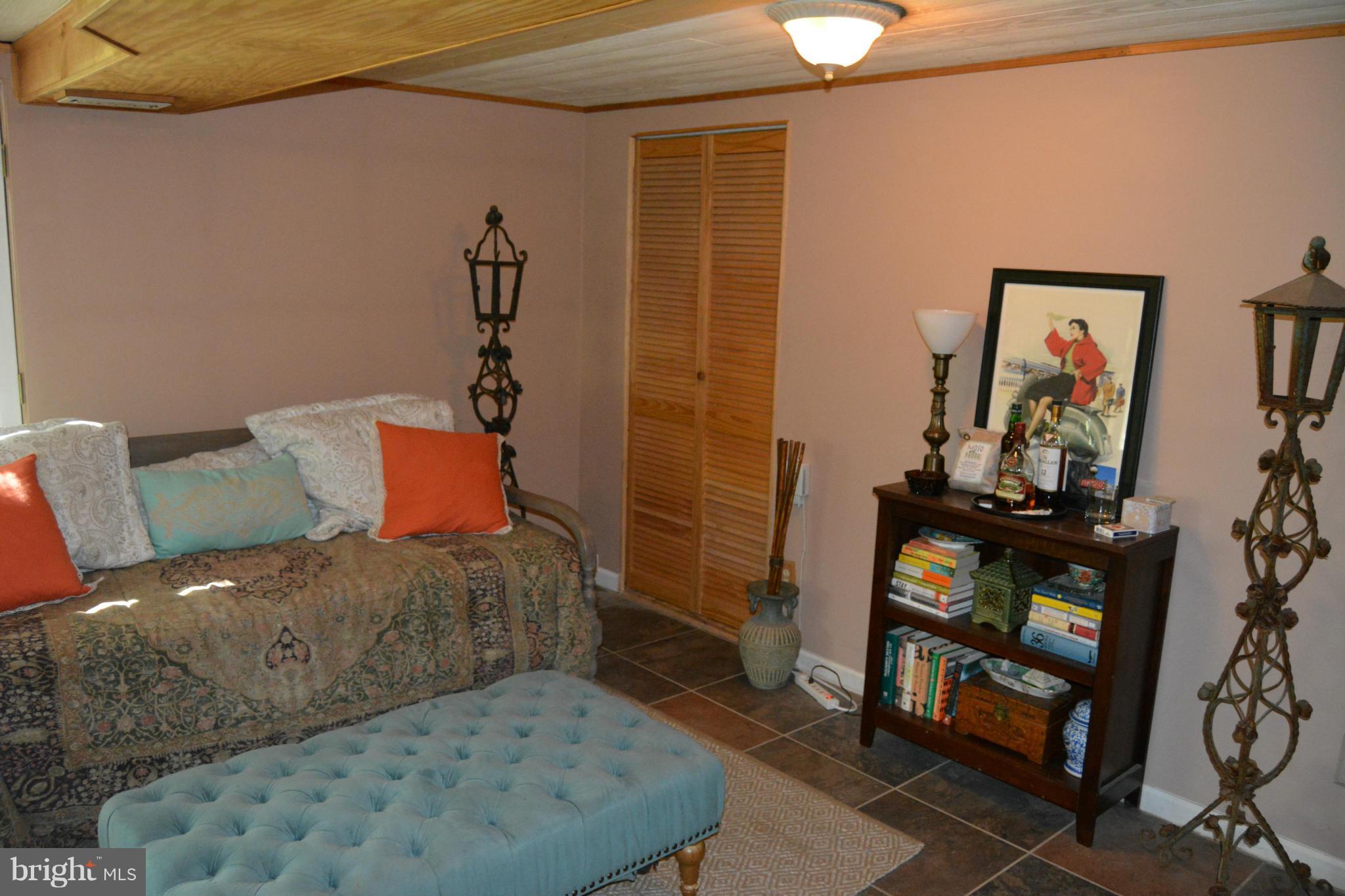 348 Ridge Road Pasadena, MD 21122 - Photo 16 of 27 a bedroom with a bed and wooden floor