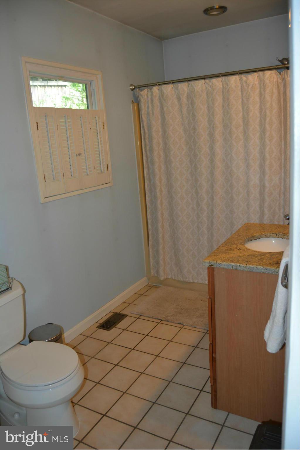 348 Ridge Road Pasadena, MD 21122 - Photo 17 of 27 a bathroom with a toilet and a sink