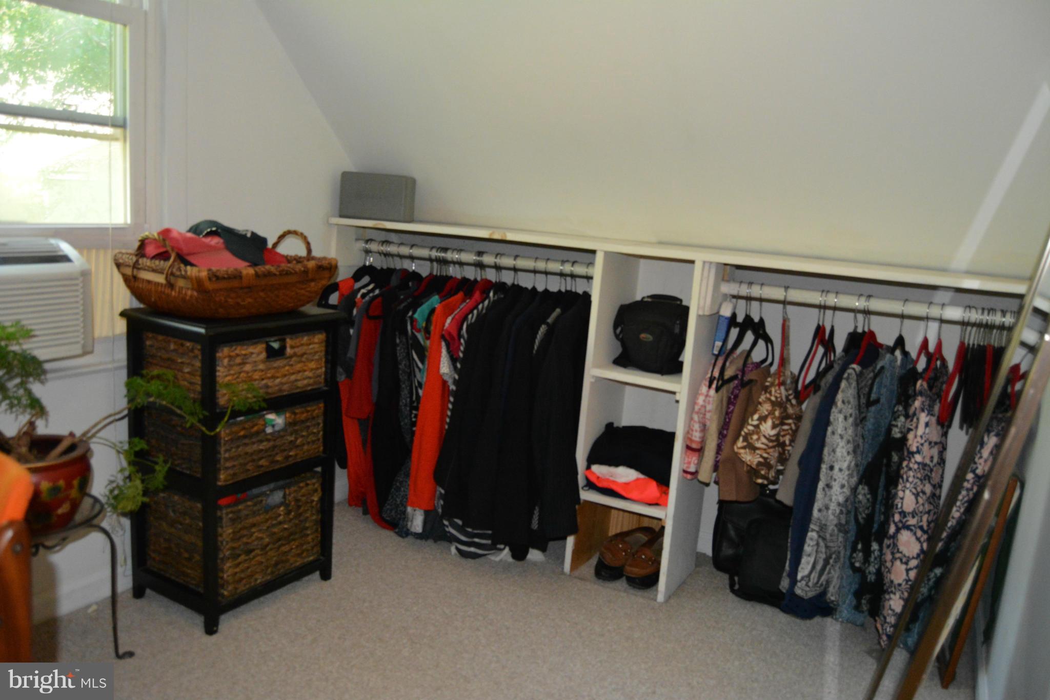 348 Ridge Road Pasadena, MD 21122 - Photo 22 of 27 a view of walk in closet with clothes and shoes