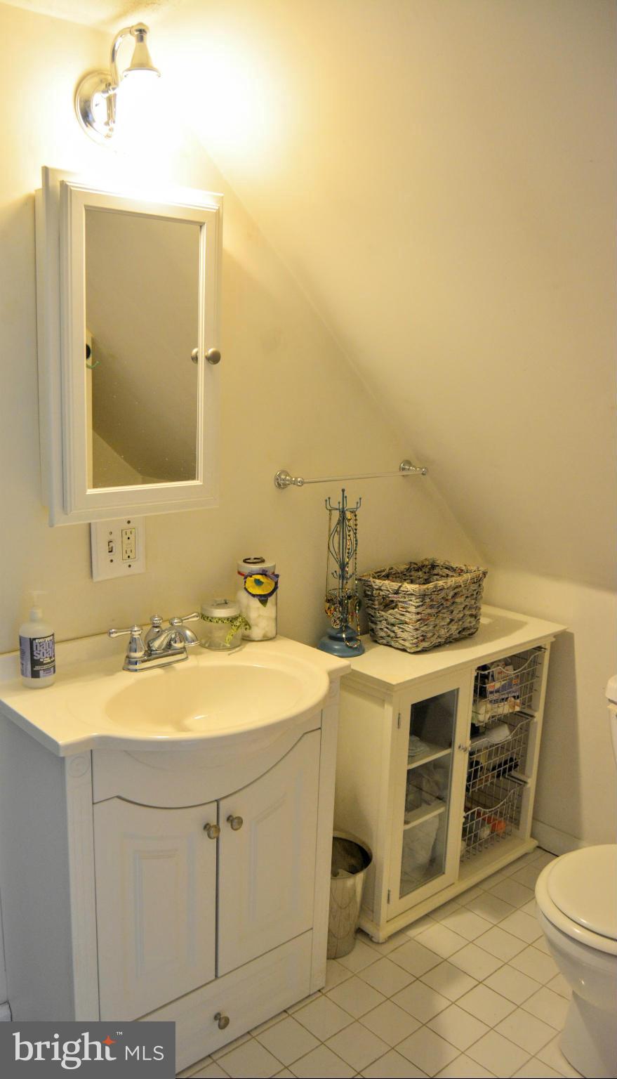 348 Ridge Road Pasadena, MD 21122 - Photo 24 of 27 a bathroom with a sink and a mirror