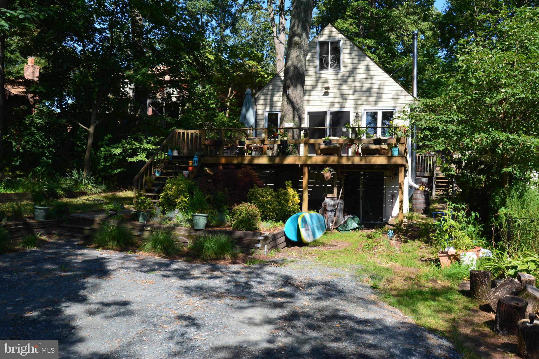 348 Ridge Road Pasadena, MD 21122 - Photo 4 of 27 a view of a house with yard and sitting area