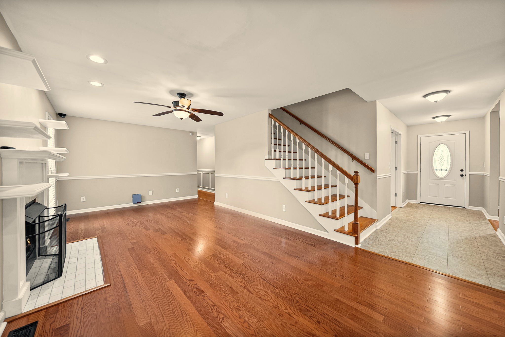 748 Gholson Road Clarksville, TN 37043 - Photo 18 of 87 a view of a livingroom with wooden floor and staircase