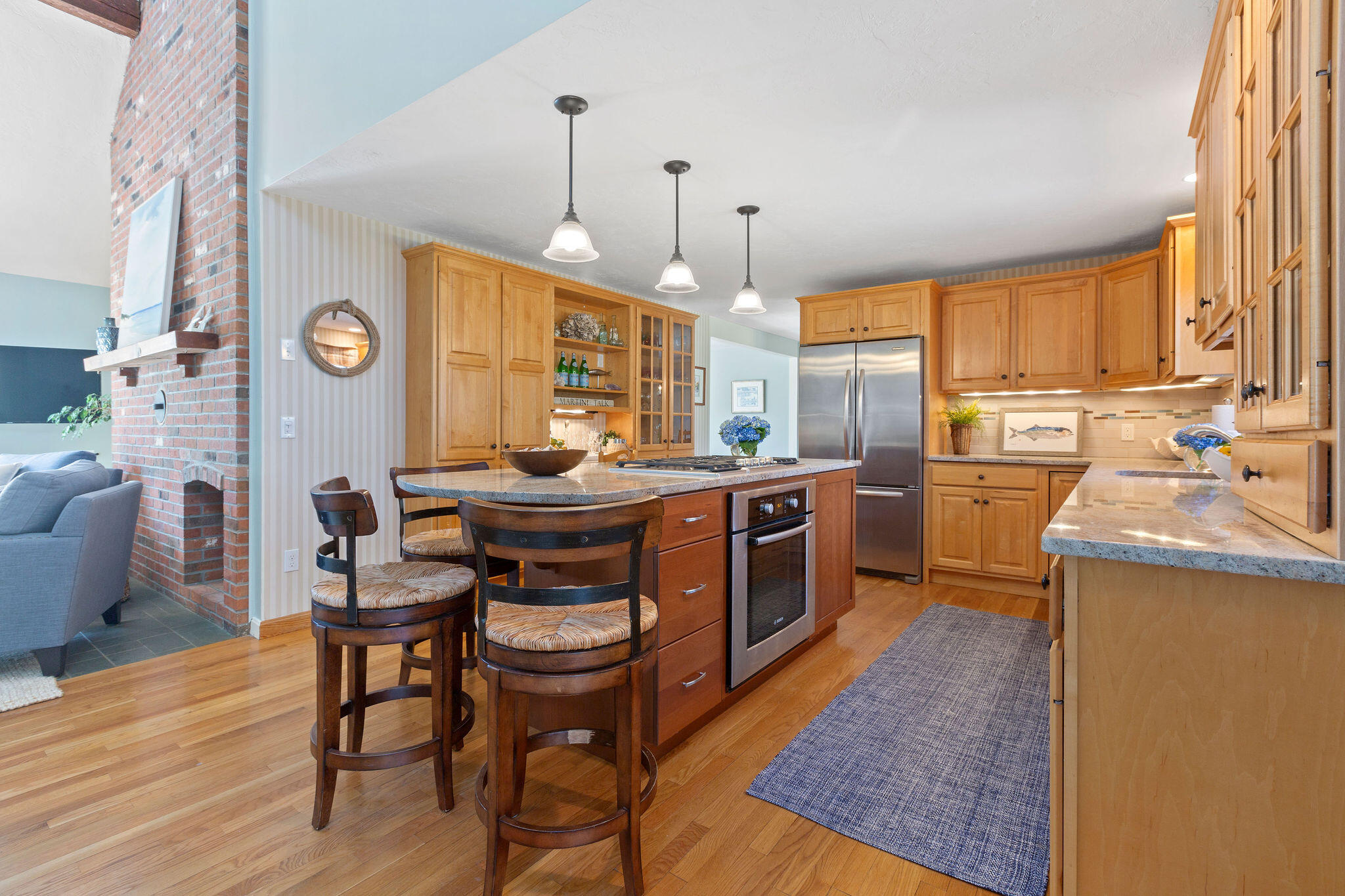 89 Screecham Way Cotuit, MA 02635 - Photo 11 of 50 a kitchen with a sink a stove and chairs