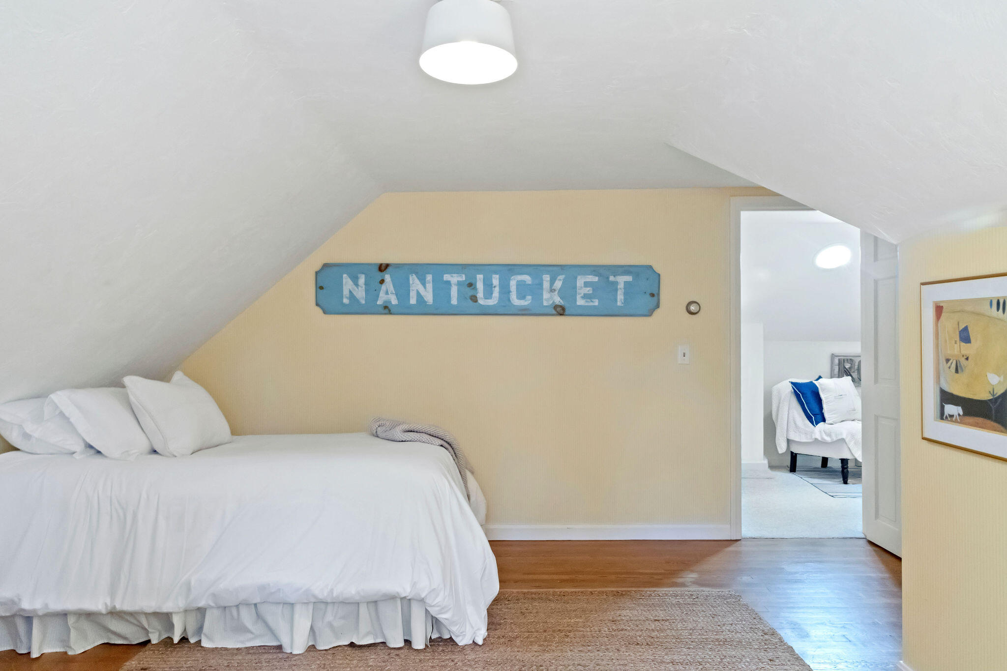89 Screecham Way Cotuit, MA 02635 - Photo 38 of 50 a bedroom with a bed and wooden floor