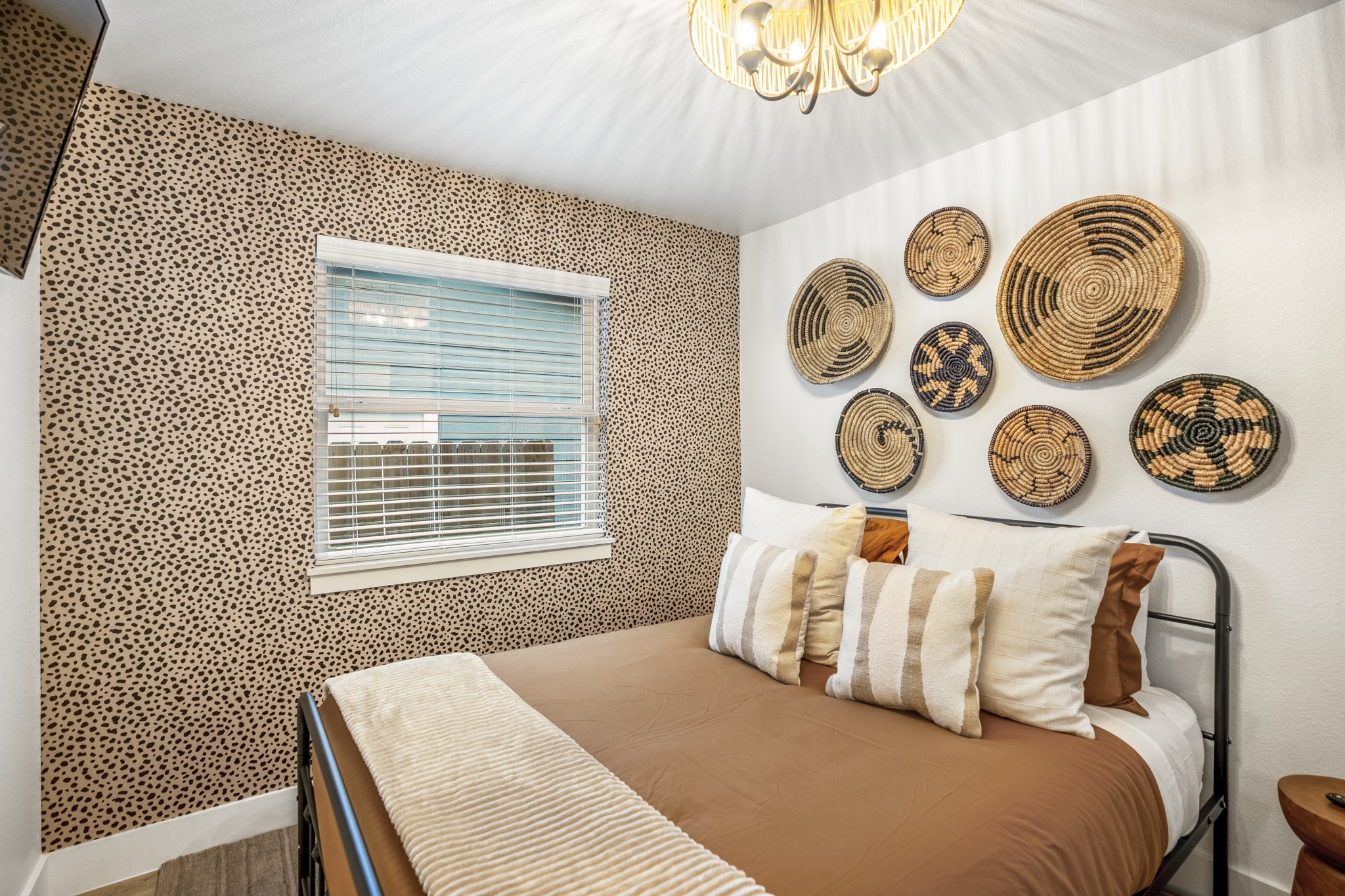 9619 Chatfield Street Houston, TX 77025 - Photo 31 of 44 a bedroom with a bed and a window